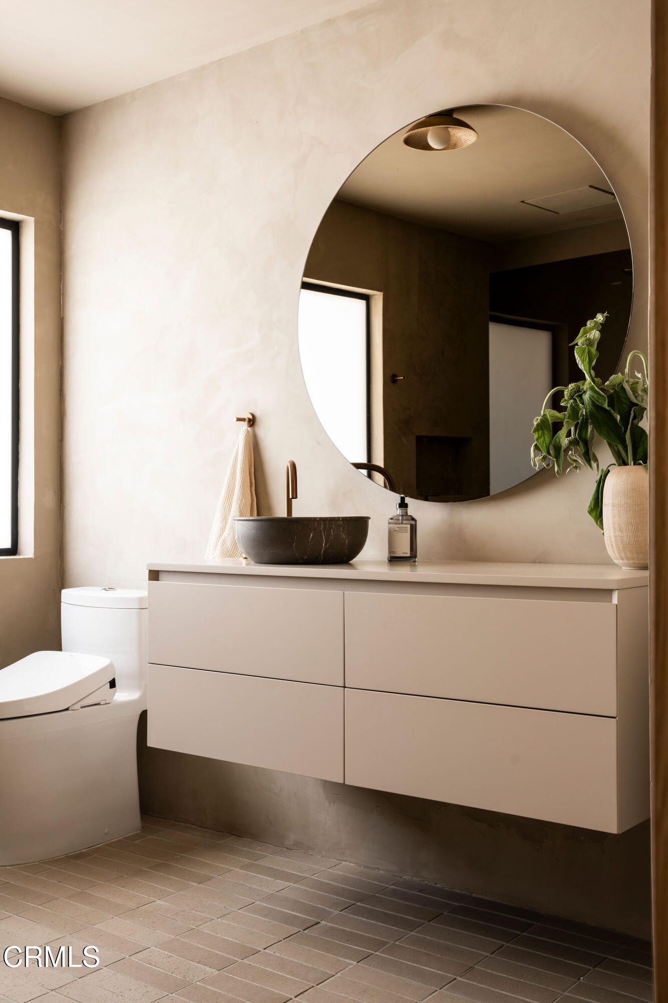 4722 Larkwood Avenue Los Angeles, CA 91364 - Photo 16 of 27 a bathroom with a toilet sink and mirror