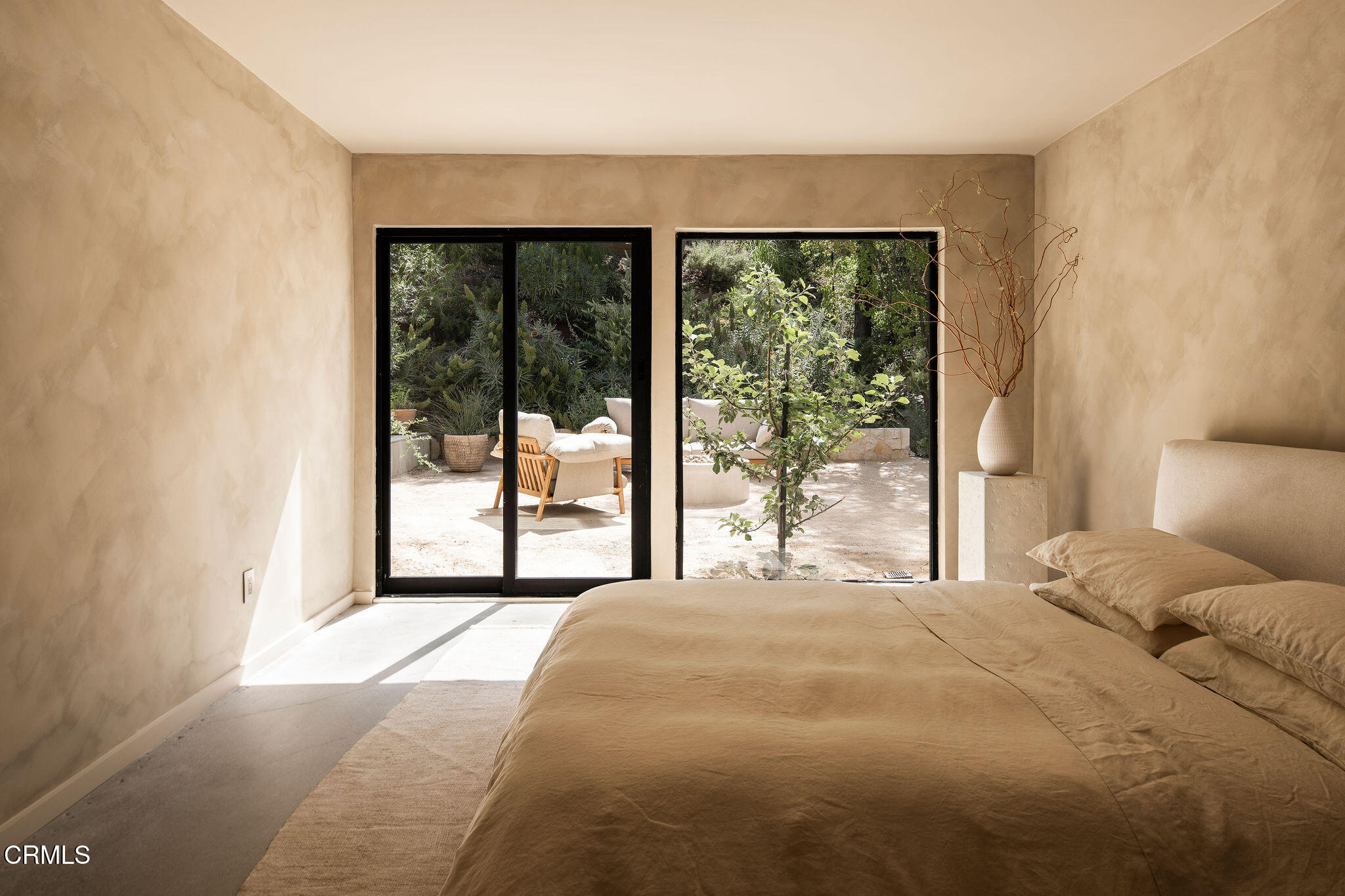 4722 Larkwood Avenue Los Angeles, CA 91364 - Photo 17 of 27 a bedroom with a large window and a balcony