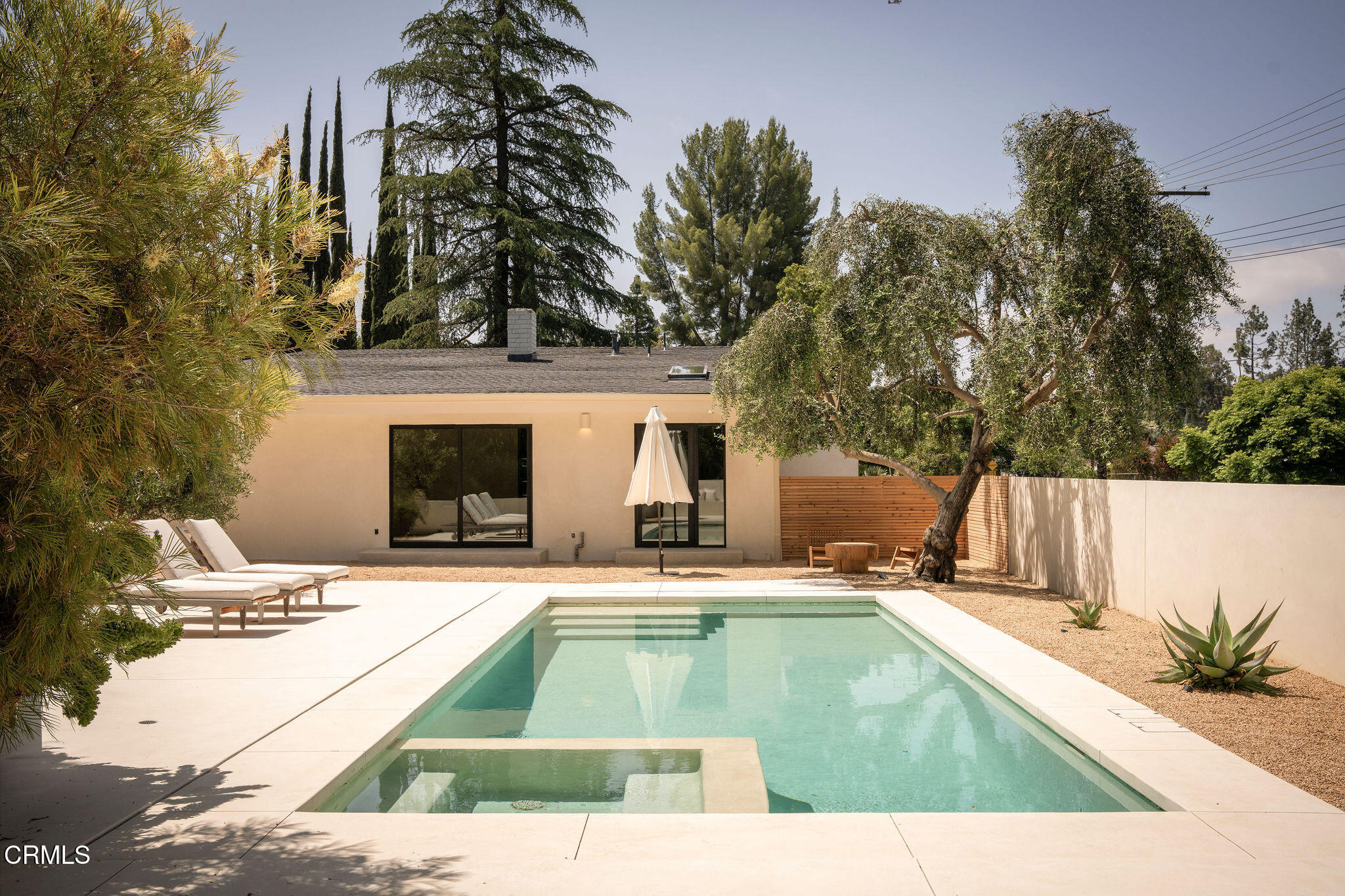 4722 Larkwood Avenue Los Angeles, CA 91364 - Photo 23 of 27 a view of swimming pool with outdoor seating and house in the background