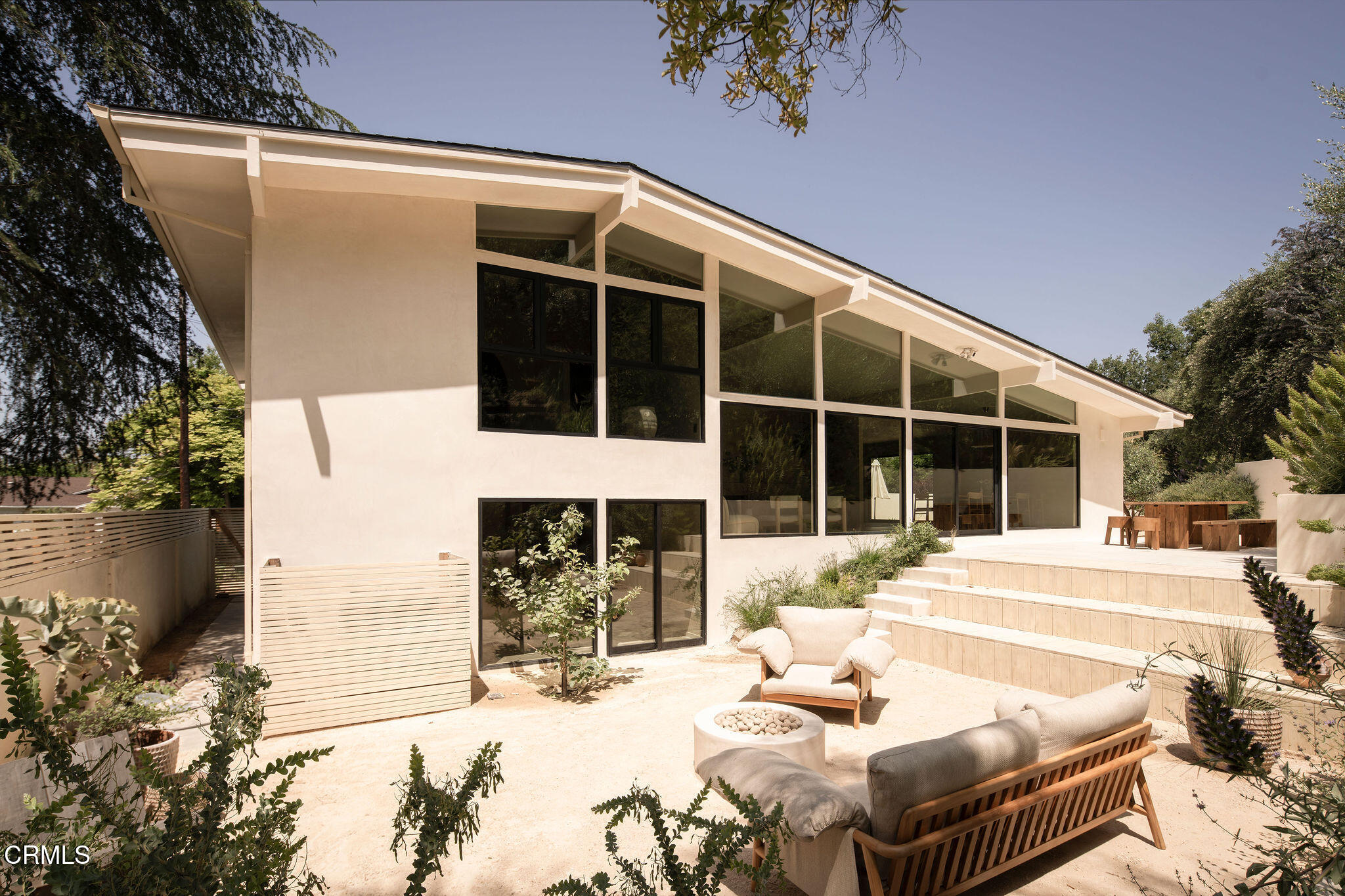 4722 Larkwood Avenue Los Angeles, CA 91364 - Photo 27 of 27 a view of a patio with table and chairs and potted plants