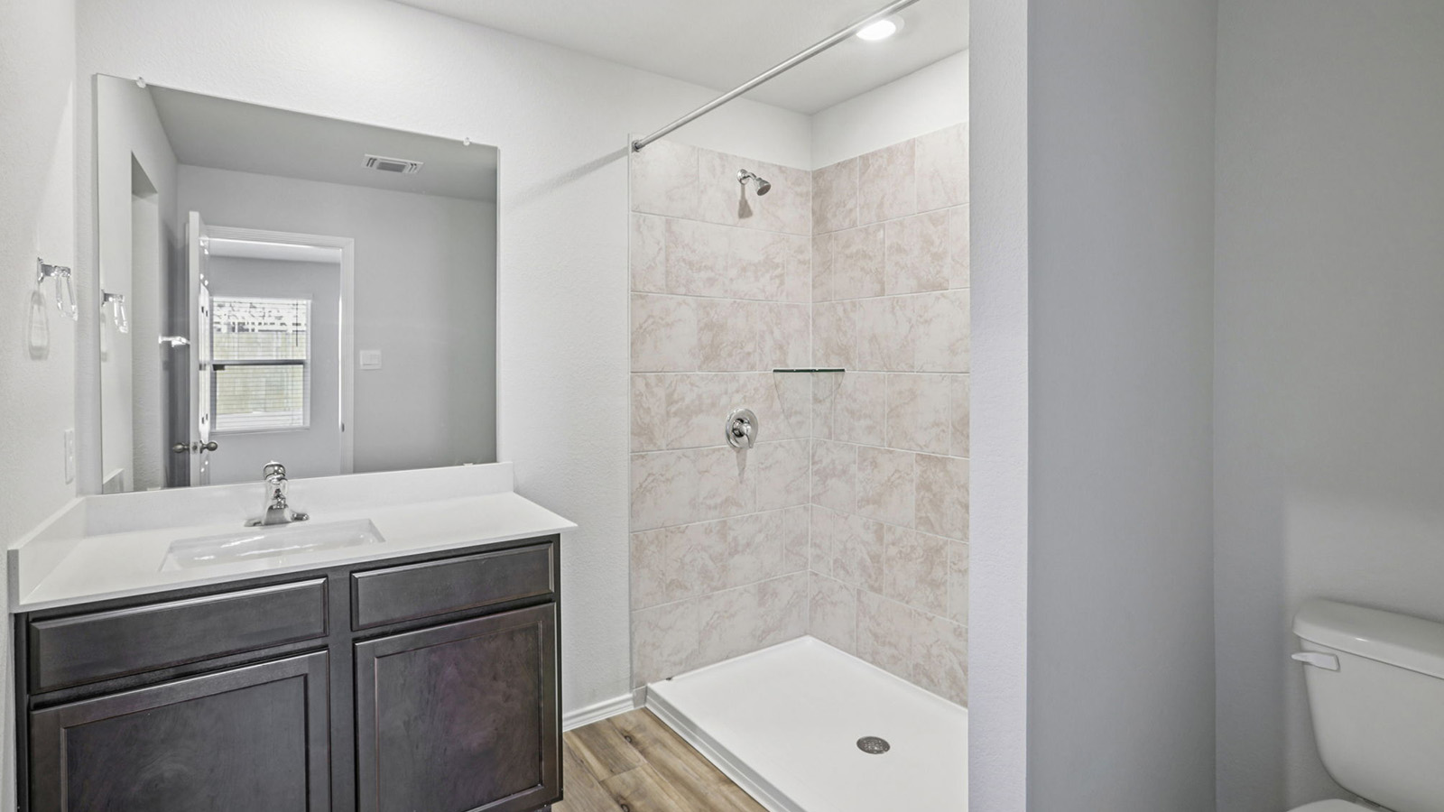 149 Wyatt Way Jarrell, TX 76537 - Photo 11 of 30 a bathroom with a sink a toilet and shower