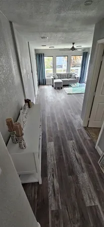 a view of a livingroom with furniture and windows