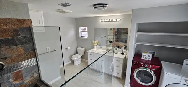 a view of a storage & utility room with washer and dryer