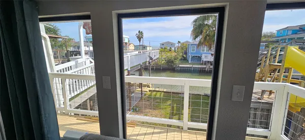 a view of a glass door and a living room