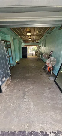 a view of garage with a couch