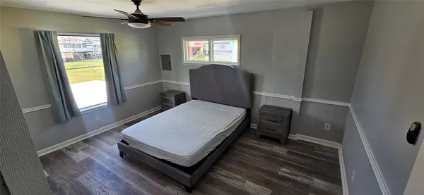 a living room with a bed furniture and a window