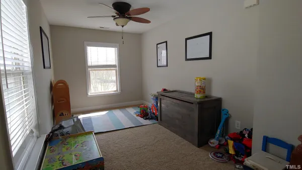 a bed room with a bed and a window