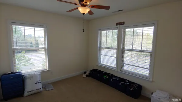 a bed room with a bed and a window