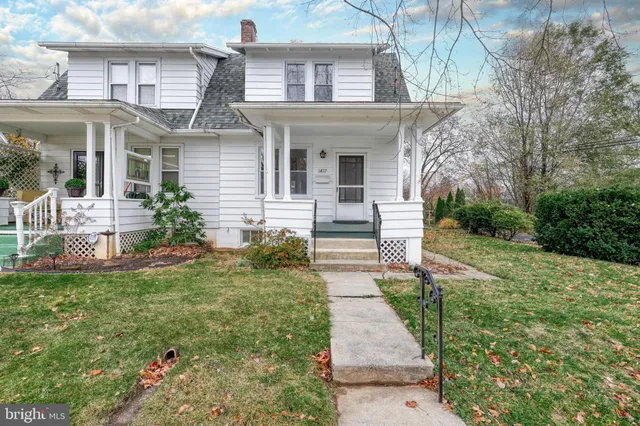 front view of a house with a yard