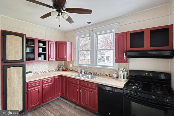 a kitchen with stainless steel appliances granite countertop a stove sink and microwave