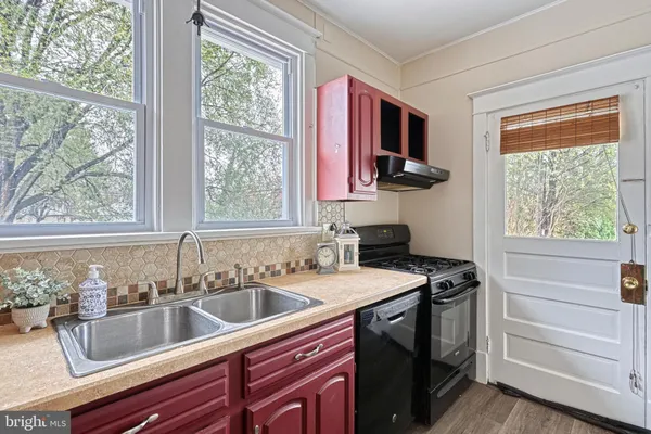 a kitchen that has a sink and a stove