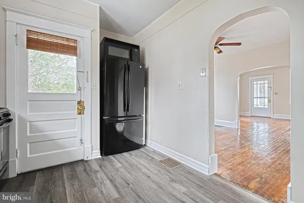a view of a hallway view with wooden floor and staircase