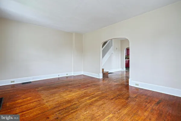 a view of a room with wooden floor