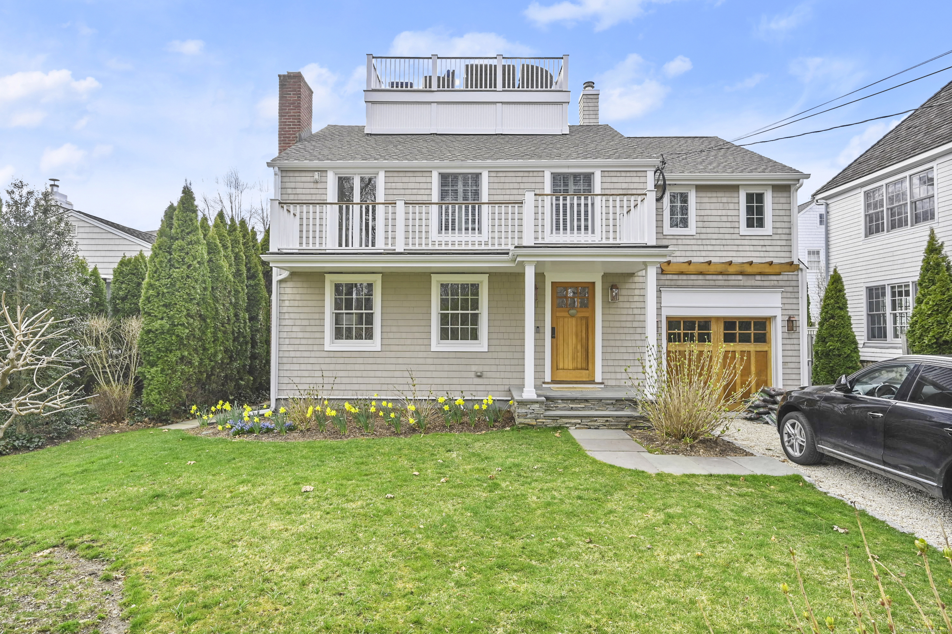 a front view of a house with a yard