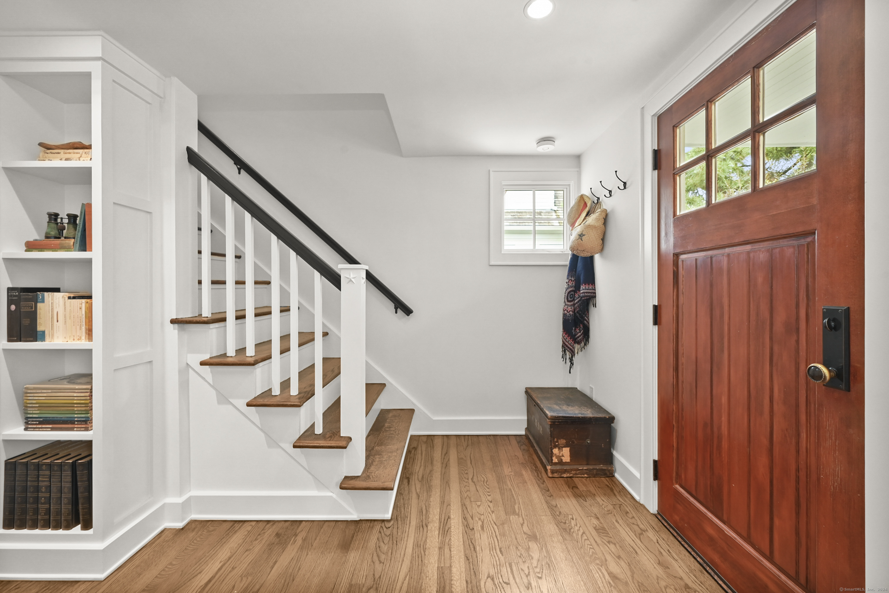 104 Roton Avenue Norwalk, CT 06853 - Photo 18 of 40 a view of entryway with wooden floor and stairs