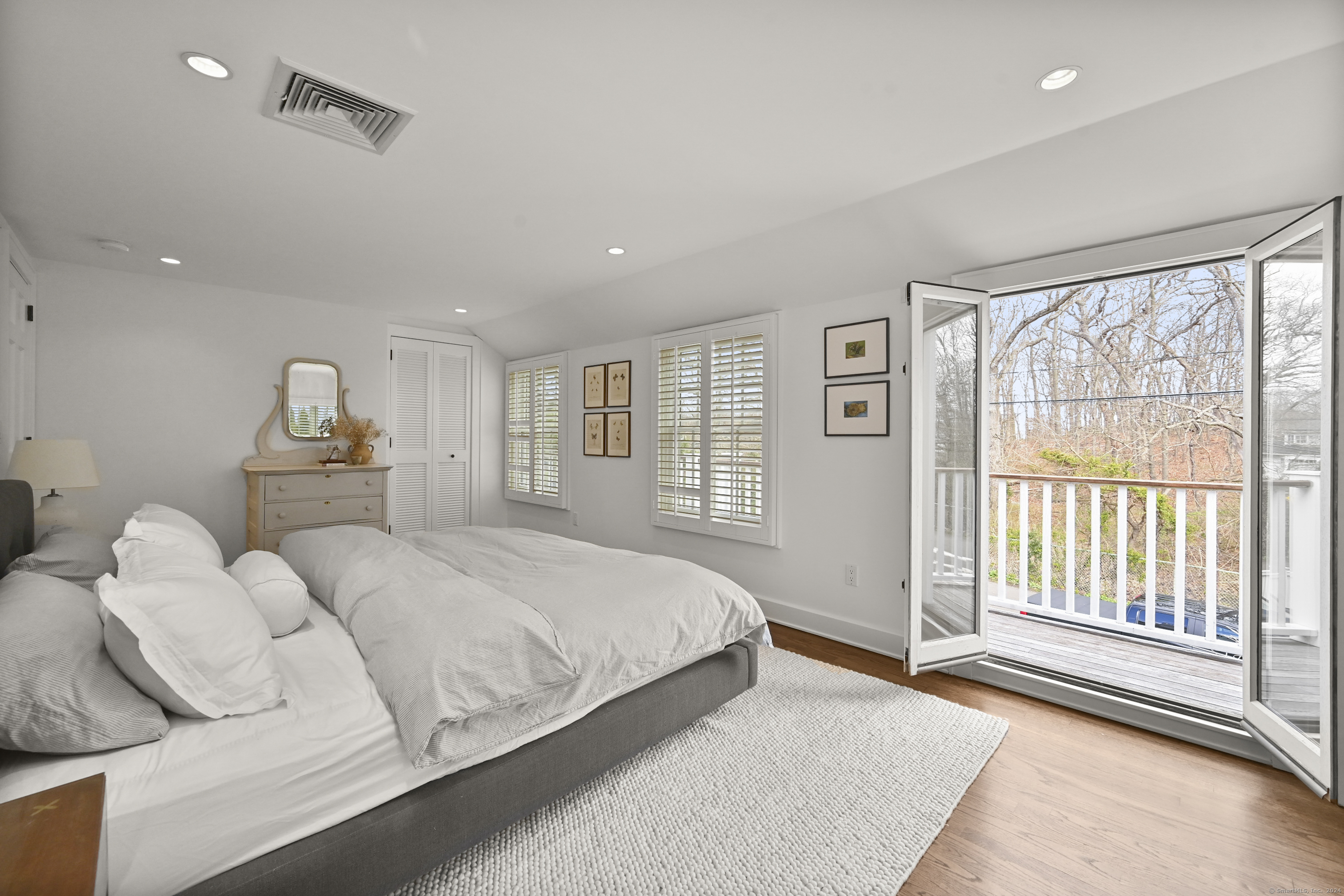104 Roton Avenue Norwalk, CT 06853 - Photo 20 of 40 a bedroom with a bed and a large window