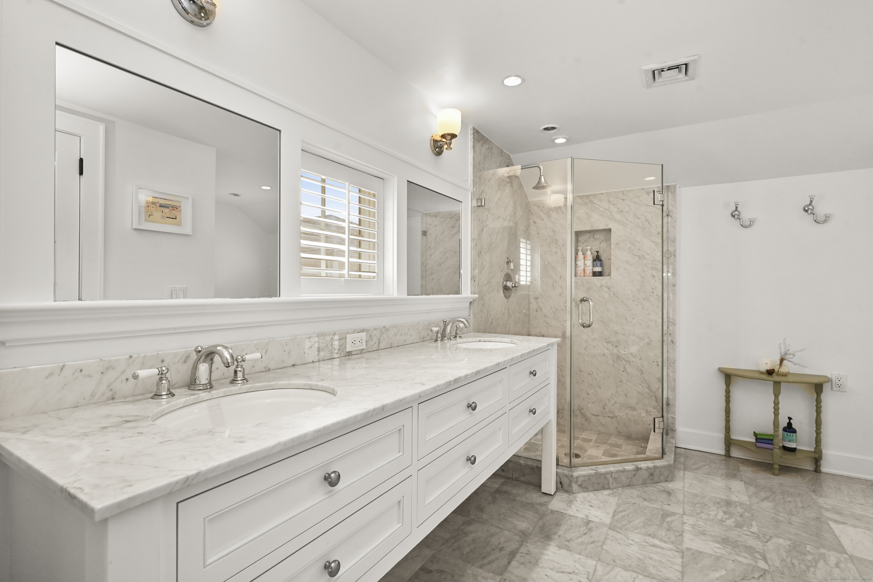 104 Roton Avenue Norwalk, CT 06853 - Photo 22 of 40 a bathroom with a granite countertop sink mirror and double