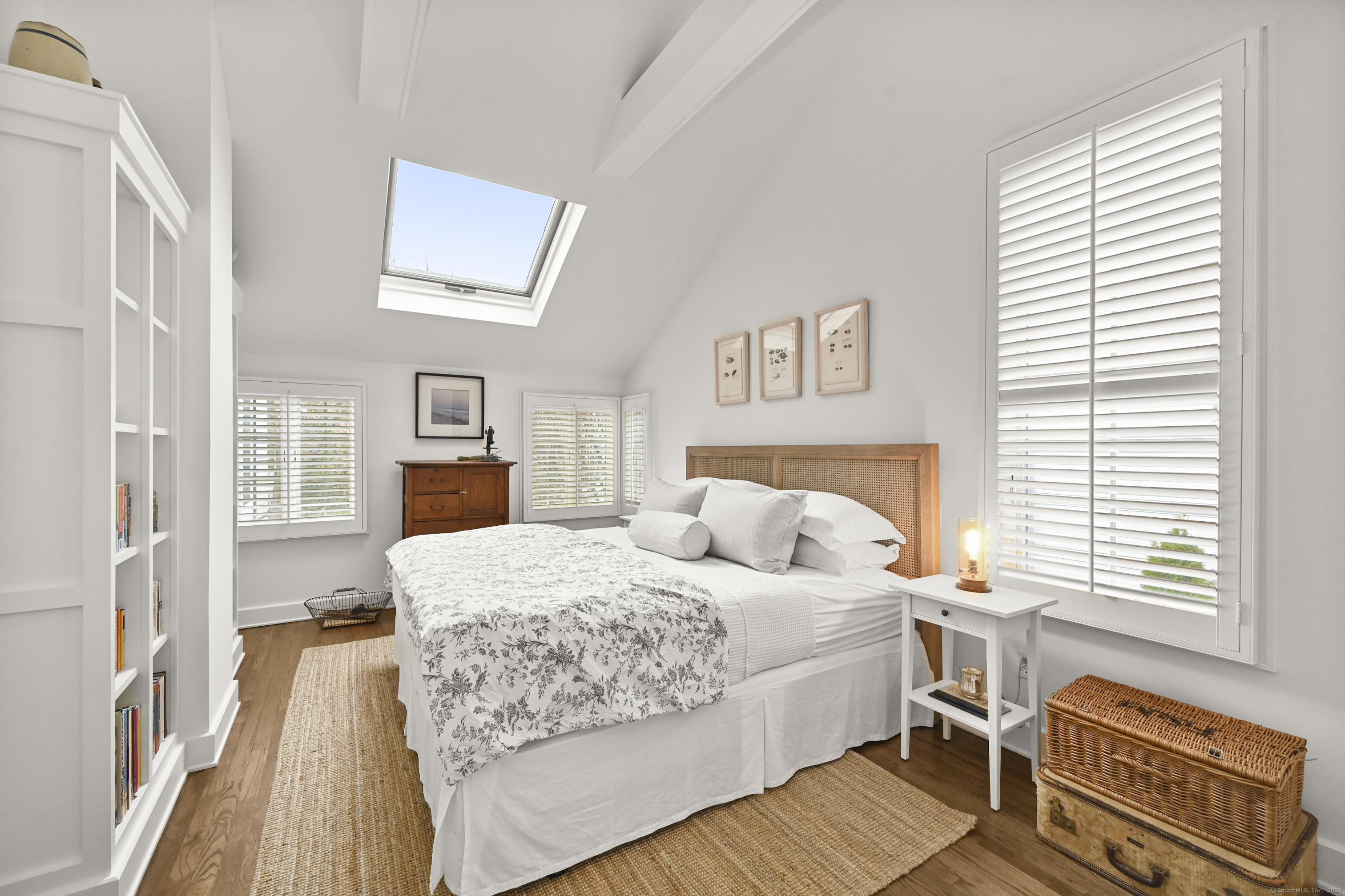 104 Roton Avenue Norwalk, CT 06853 - Photo 25 of 40 a bedroom with a bed and wooden floor