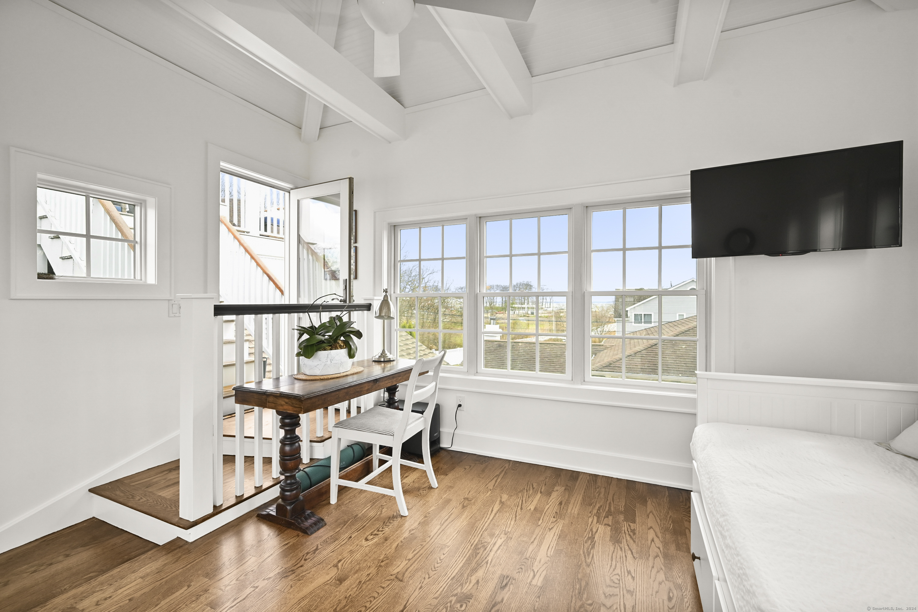 104 Roton Avenue Norwalk, CT 06853 - Photo 31 of 40 a view of a livingroom with furniture window and wooden floor