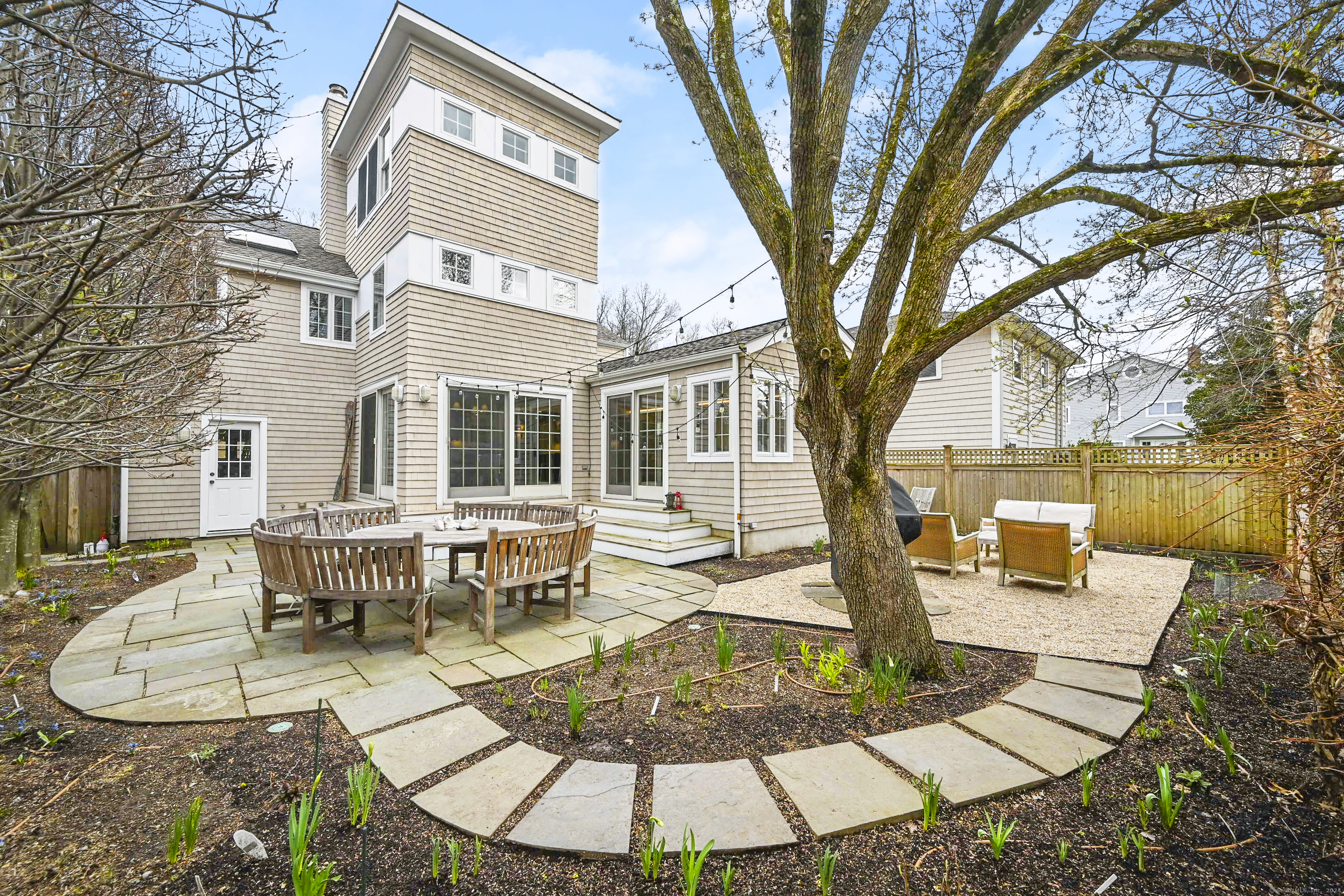 104 Roton Avenue Norwalk, CT 06853 - Photo 35 of 40 a view of a house with backyard porch and sitting area