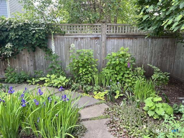 104 Roton Avenue Norwalk, CT 06853 - Photo 38 of 40 a view of a garden with wooden fence