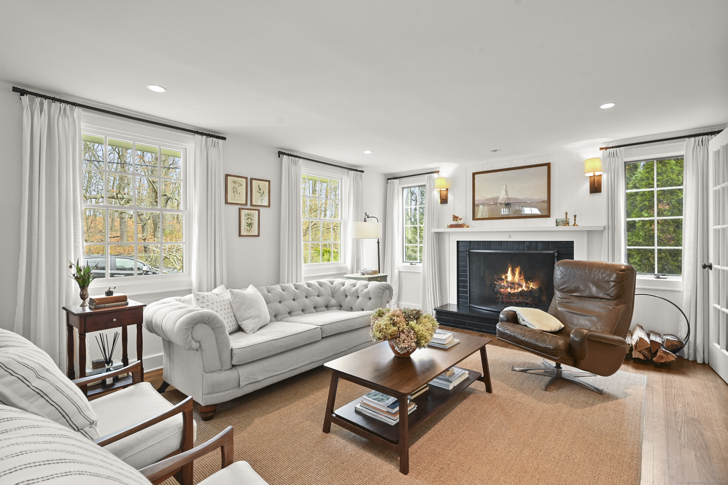 104 Roton Avenue Norwalk, CT 06853 - Photo 4 of 40 a living room with furniture and a fireplace