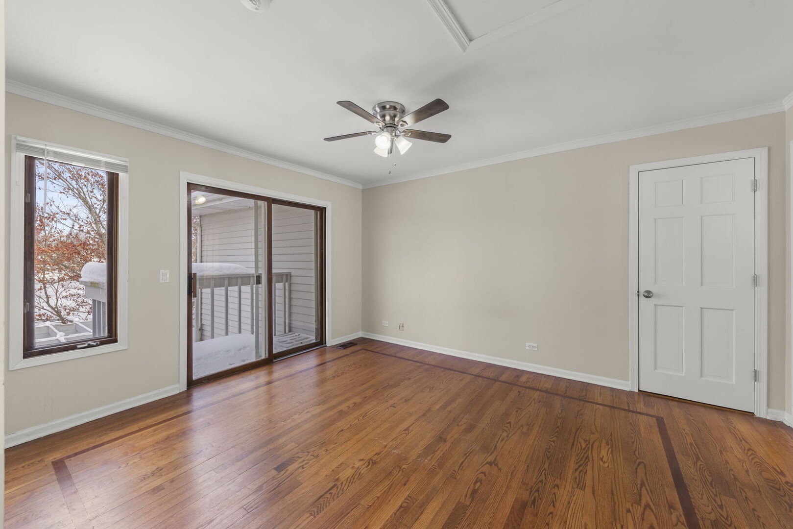338 Hiawatha Drive Lake In The Hills, IL 60156 - Photo 14 of 49 a view of an empty room with a window and wooden floor