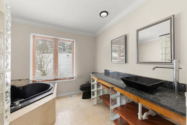 a kitchen that has a sink and a stove