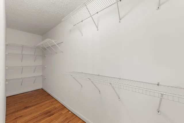 a view of a room with racks on the wall