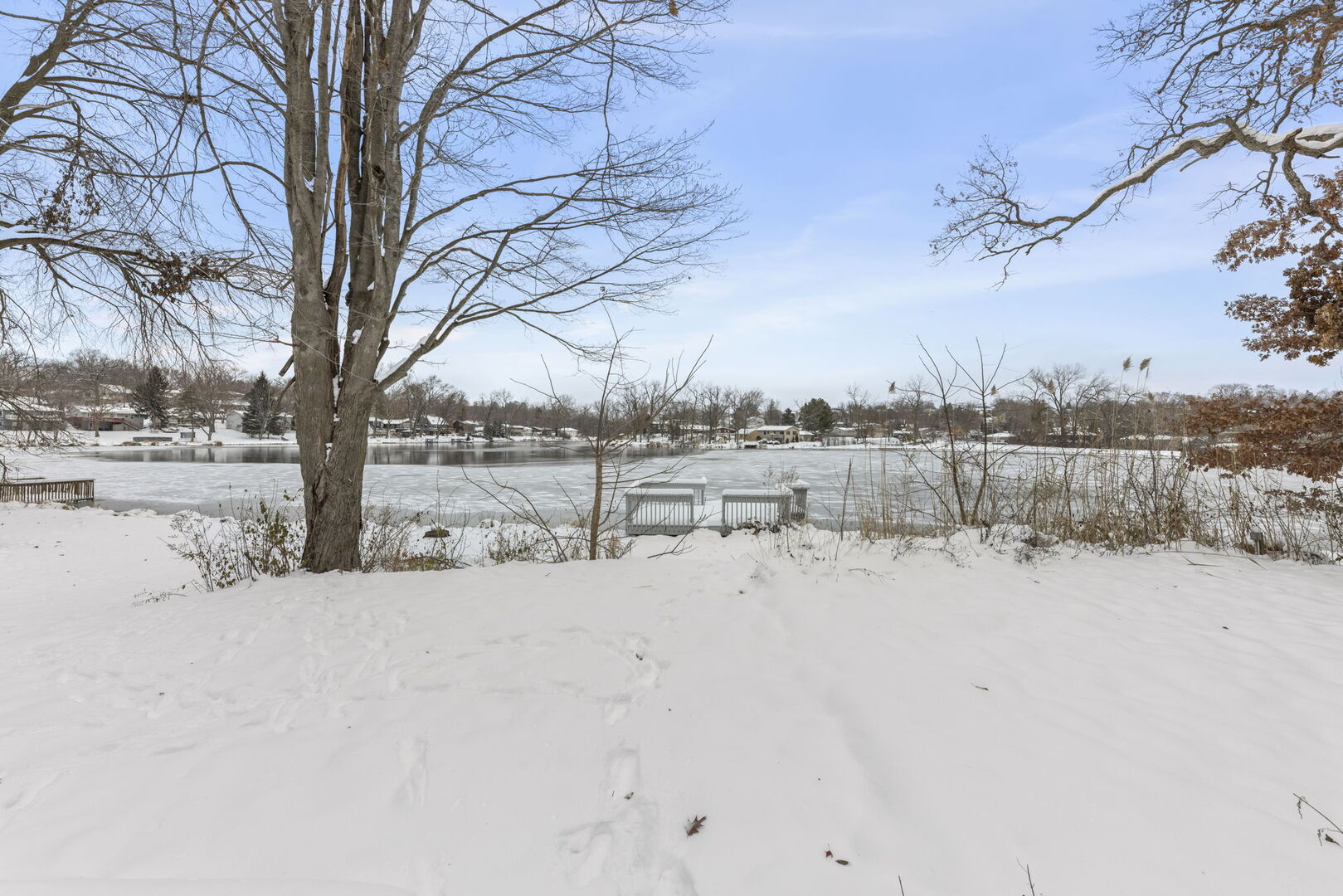 338 Hiawatha Drive Lake In The Hills, IL 60156 - Photo 2 of 49 a view of yard covered with snow in front of house