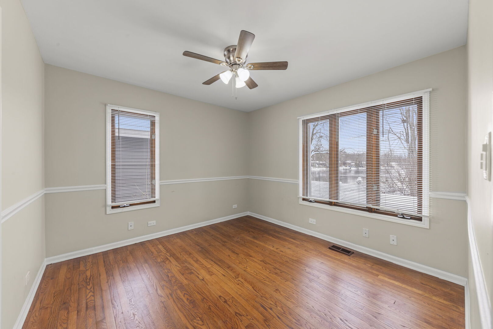 338 Hiawatha Drive Lake In The Hills, IL 60156 - Photo 24 of 49 wooden floor in an empty room with a window