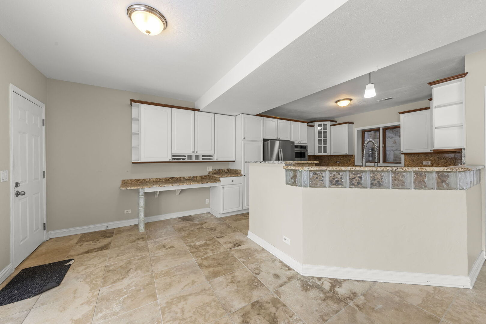 338 Hiawatha Drive Lake In The Hills, IL 60156 - Photo 9 of 49 a kitchen with a refrigerator and a stove top oven