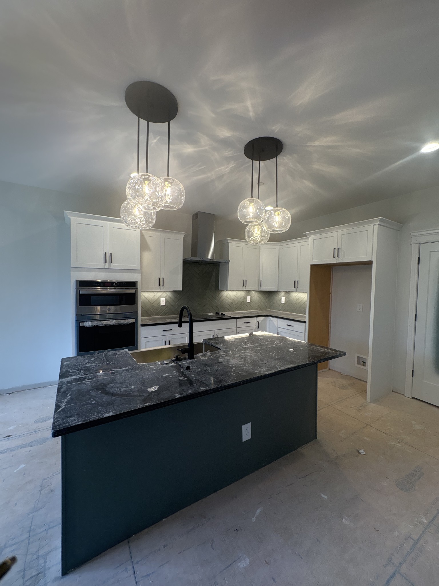 353 Young Lane Pleasant View, TN 37146 - Photo 15 of 26 a kitchen with stainless steel appliances granite countertop a sink a counter space and cabinets