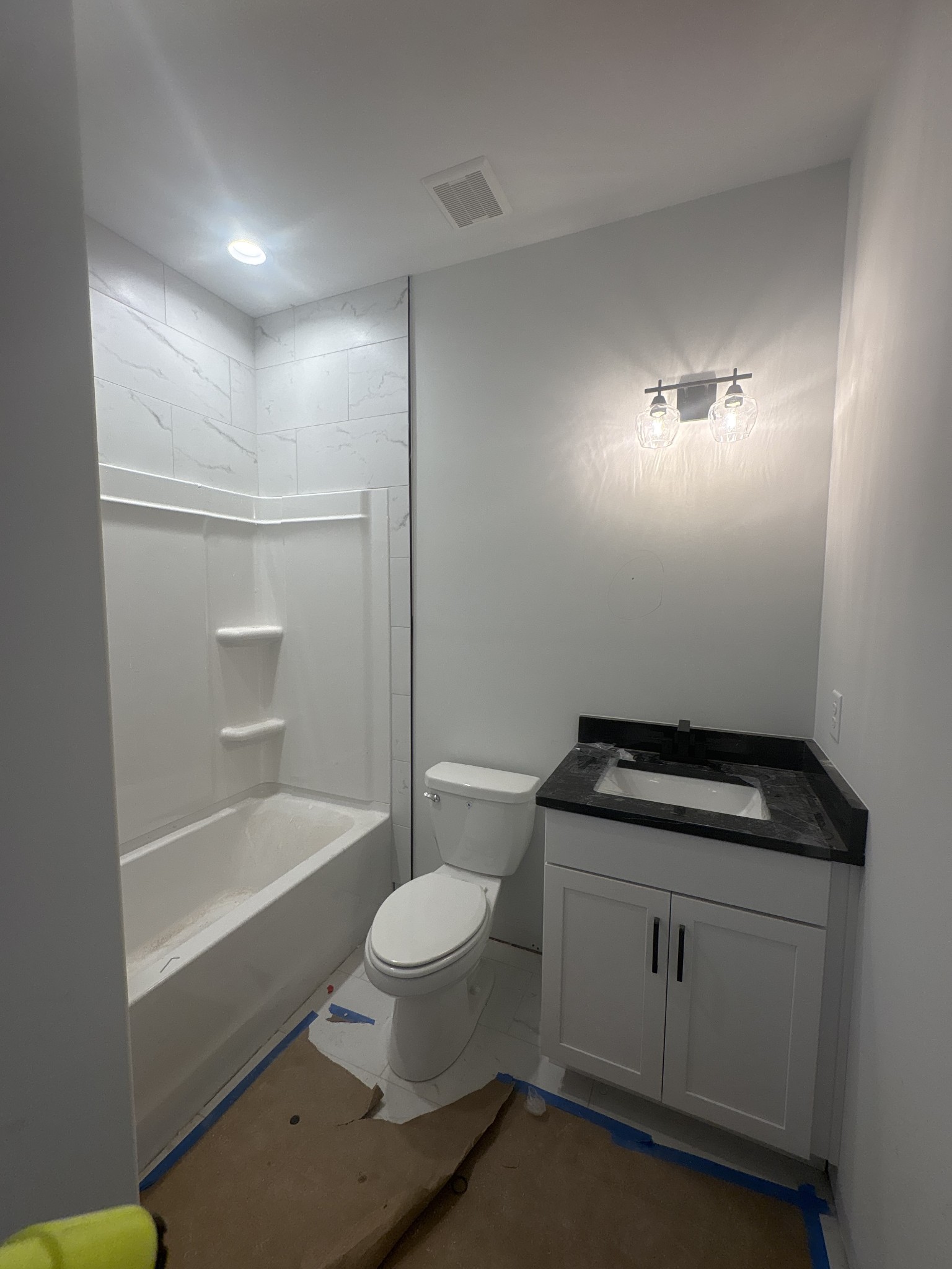 353 Young Lane Pleasant View, TN 37146 - Photo 20 of 26 a bathroom with a granite countertop sink toilet and shower