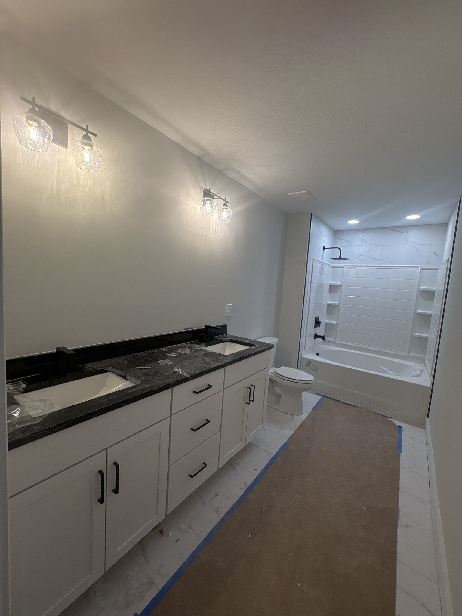 353 Young Lane Pleasant View, TN 37146 - Photo 25 of 26 a kitchen with granite countertop white cabinets and white appliances