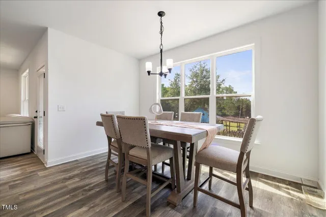 a view of entryway with wooden floor and stairs
