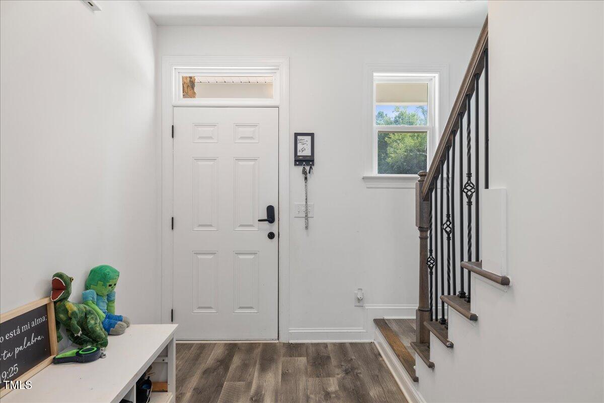 5421 West Old Spring Hope Road Spring Hope, NC 27882 - Photo 13 of 54 a view of a room with wooden floor and a potted plant