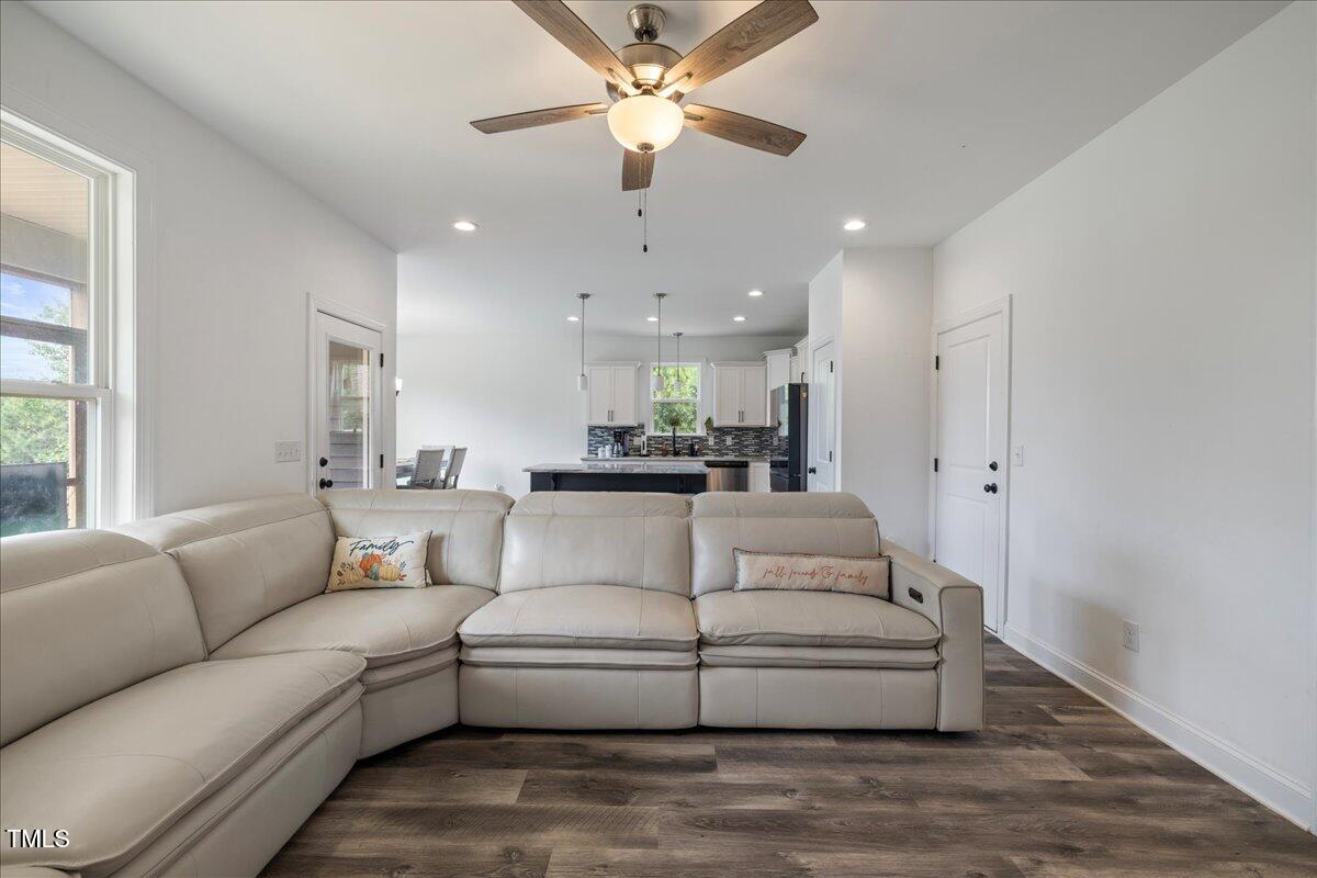 5421 West Old Spring Hope Road Spring Hope, NC 27882 - Photo 2 of 54 a living room with furniture and kitchen view