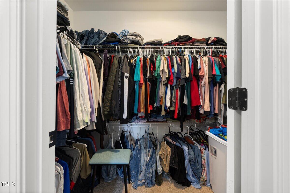 5421 West Old Spring Hope Road Spring Hope, NC 27882 - Photo 21 of 54 a view of walk in closet with clothes and shoes