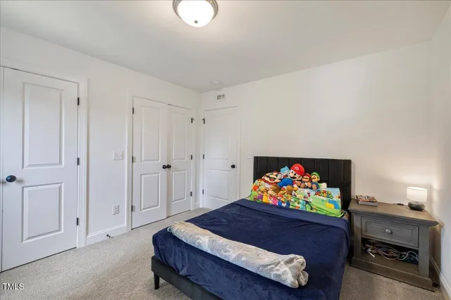 a bathroom with a sink double vanity granite toilet and a shower
