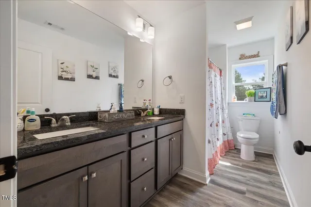 a kitchen with a sink and a refrigerator