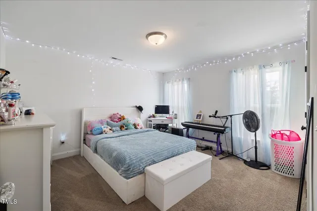 a bedroom with a bed and a cabinets