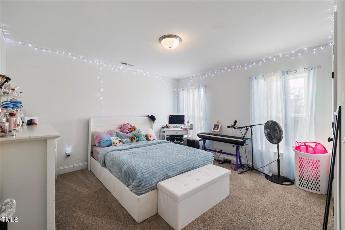 5421 West Old Spring Hope Road Spring Hope, NC 27882 - Photo 26 of 54 a living room with furniture and a table