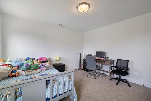 a view of a kitchen from the hallway