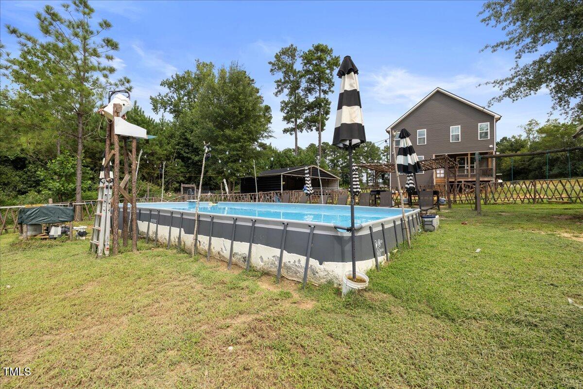 5421 West Old Spring Hope Road Spring Hope, NC 27882 - Photo 37 of 54 a view of a house with swimming pool and sitting area