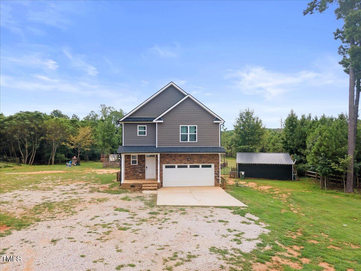 5421 West Old Spring Hope Road Spring Hope, NC 27882 - Photo 53 of 54 a front view of a house with a yard