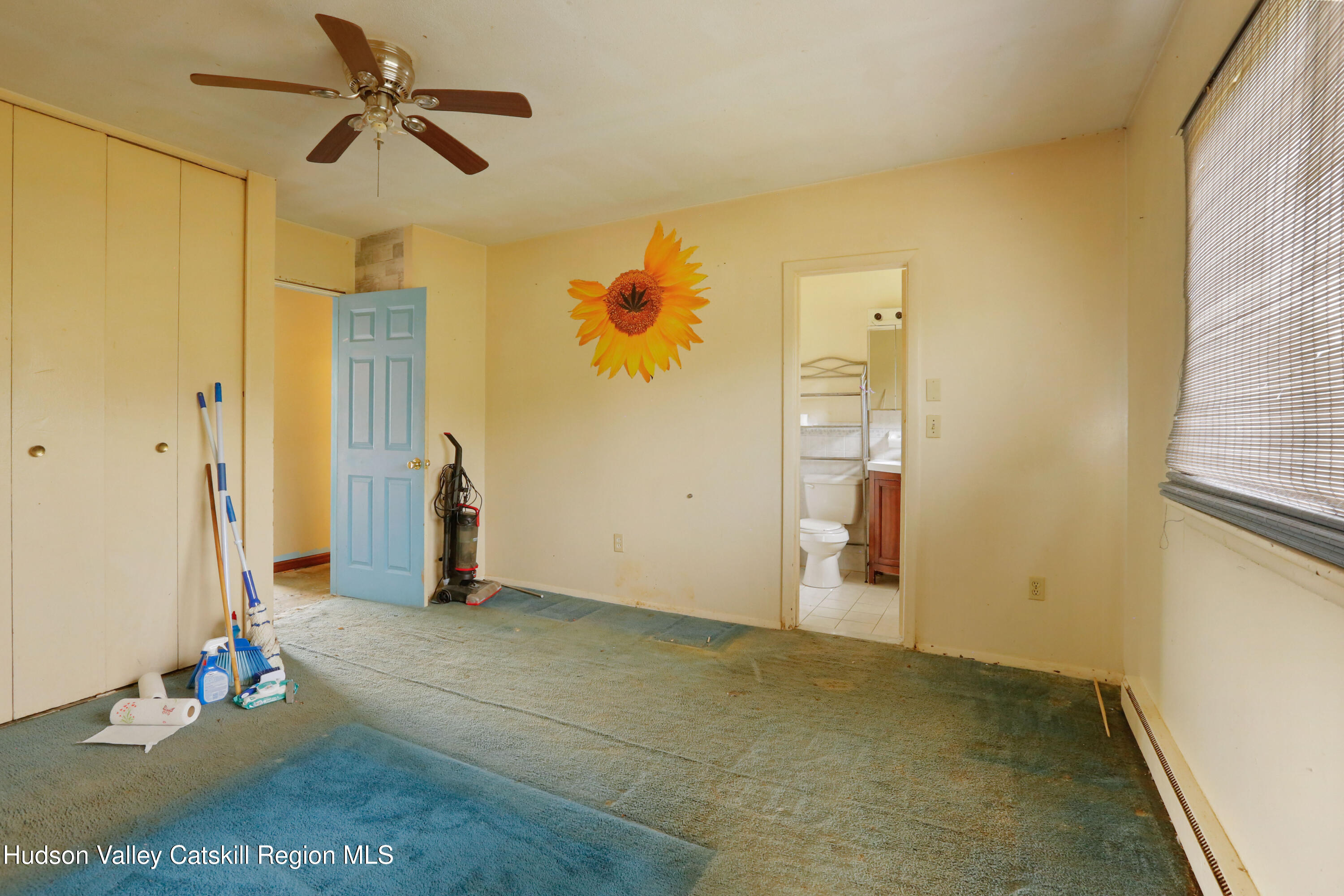 881 Albany Post Road, Unit 5 New Paltz, NY 12561 - Photo 11 of 16 a view of a livingroom with wooden floor and a ceiling fan