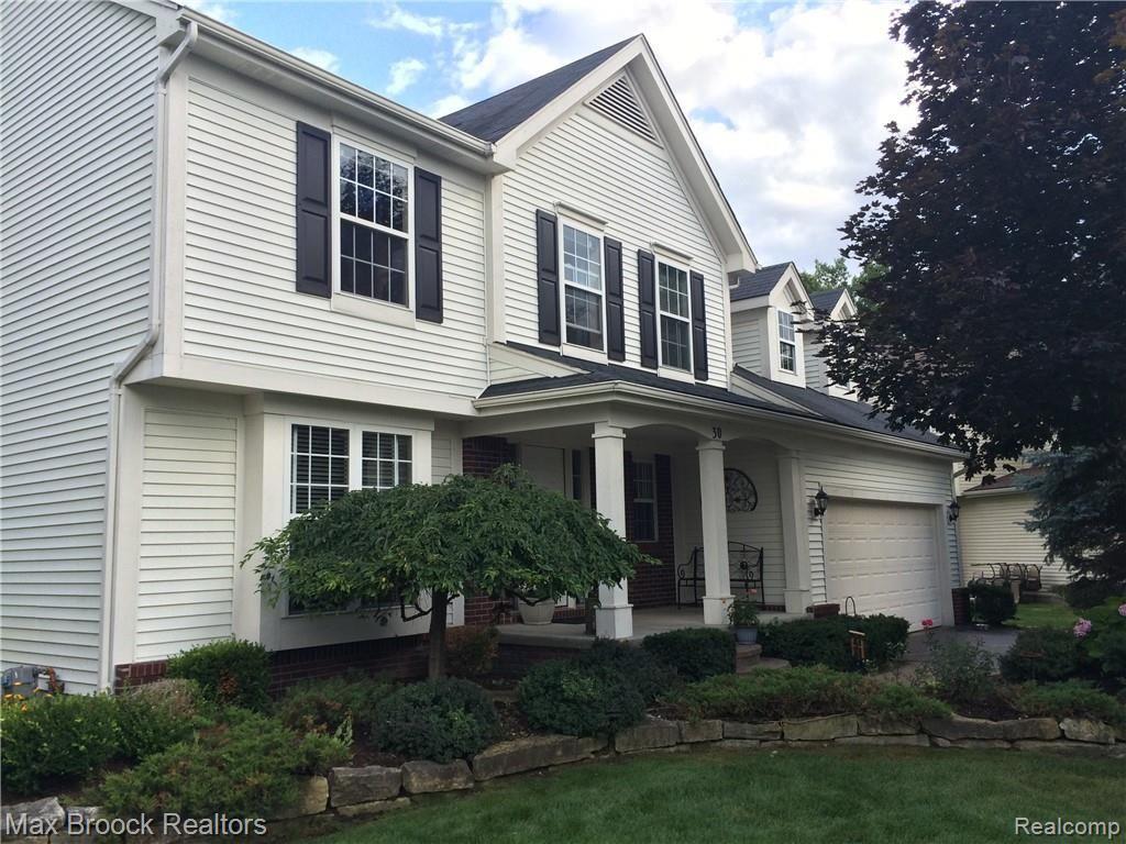 30 Ridge Field Court Oxford, MI 48371 - Photo 1 of 45 Front Elevation with beautiful landscaping for year round foliage
