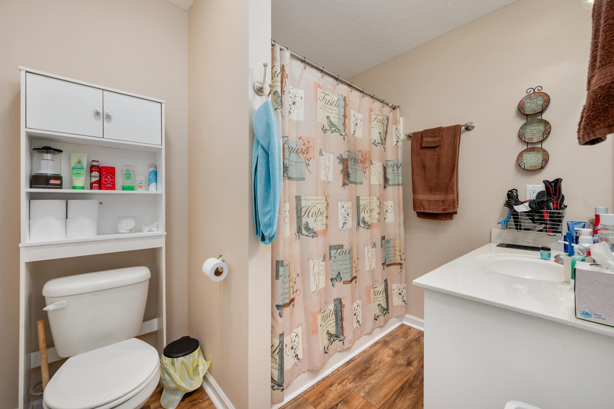 7040 Charity Road Petersburg, TN 37144 - Photo 18 of 36 a white toilet sitting next to a bathroom sink