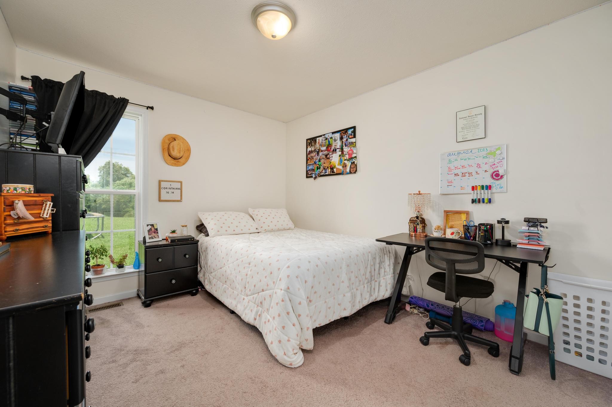 7040 Charity Road Petersburg, TN 37144 - Photo 20 of 36 a bedroom with a bed and a flat tv screen on the dresser